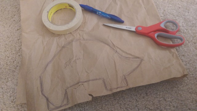 Creating the sketch for the dinosaur. As always, brown packing paper is my go-to stencil paper of choice :)